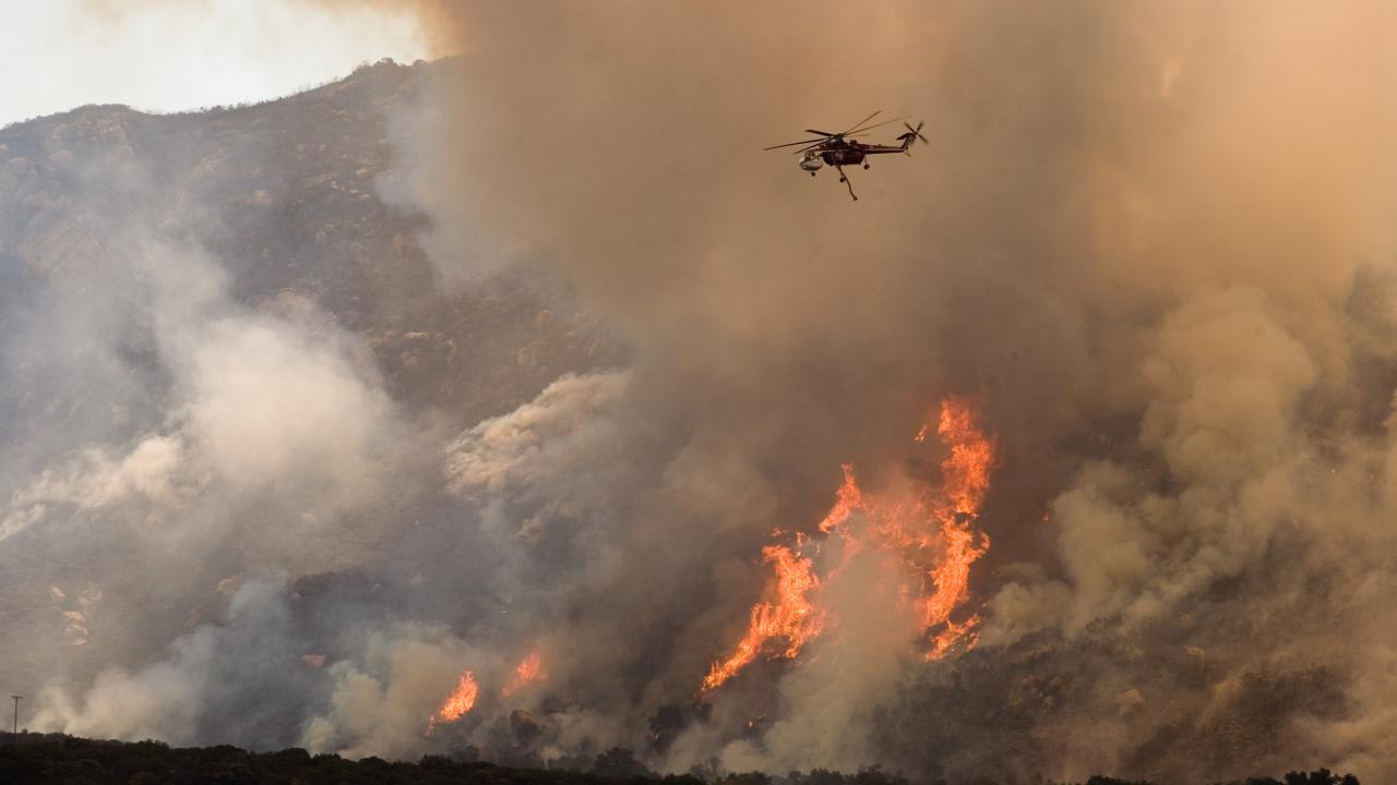 Helicopter Drops Water on Wildfire