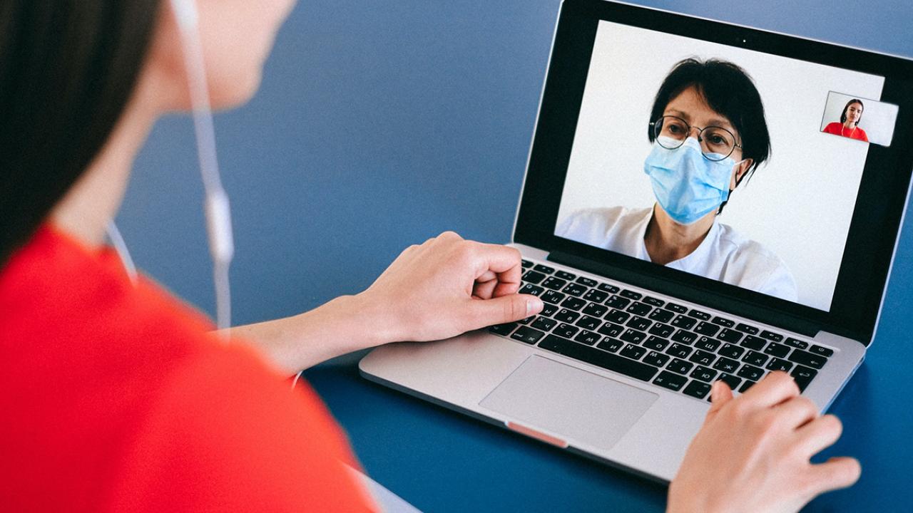 Person on a video call with a doctor