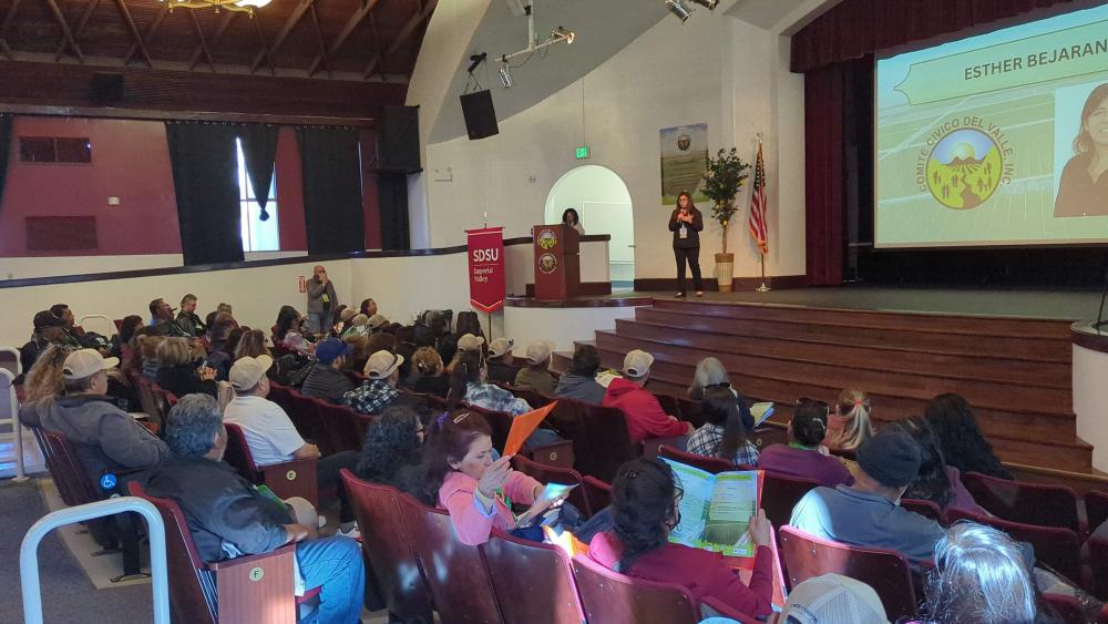 Esther speaking at the farmworker conference